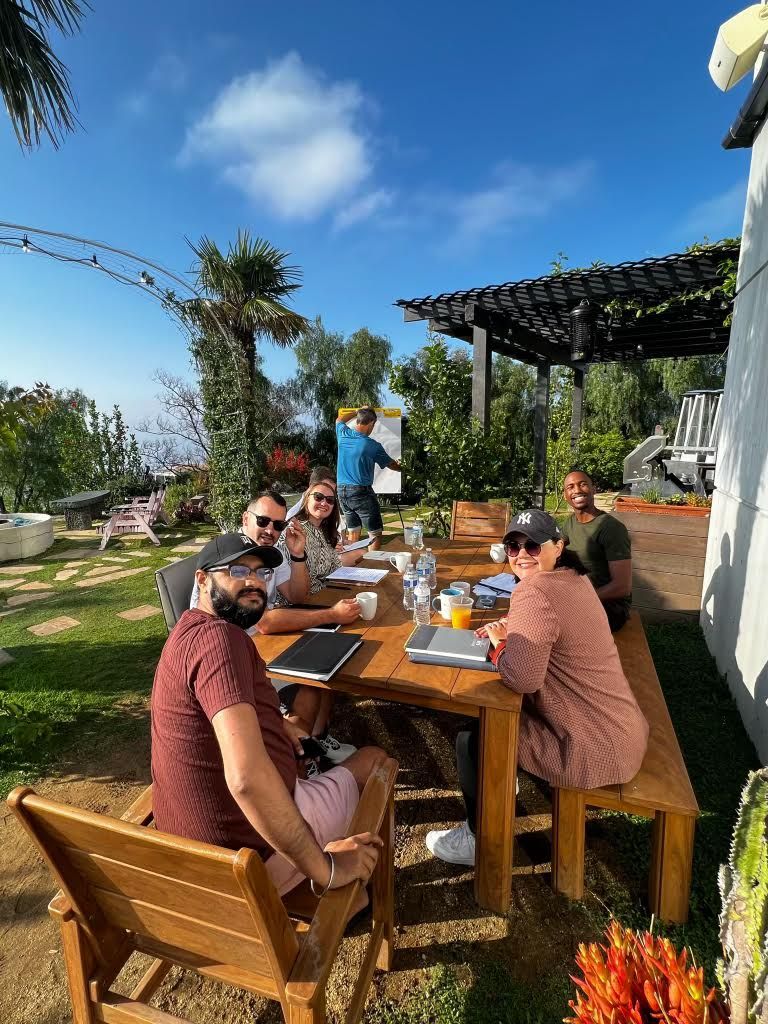 A corporate team engaged in a structured workplace habits workshop